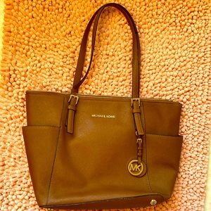 Medium sized brown Michael Kors purse
